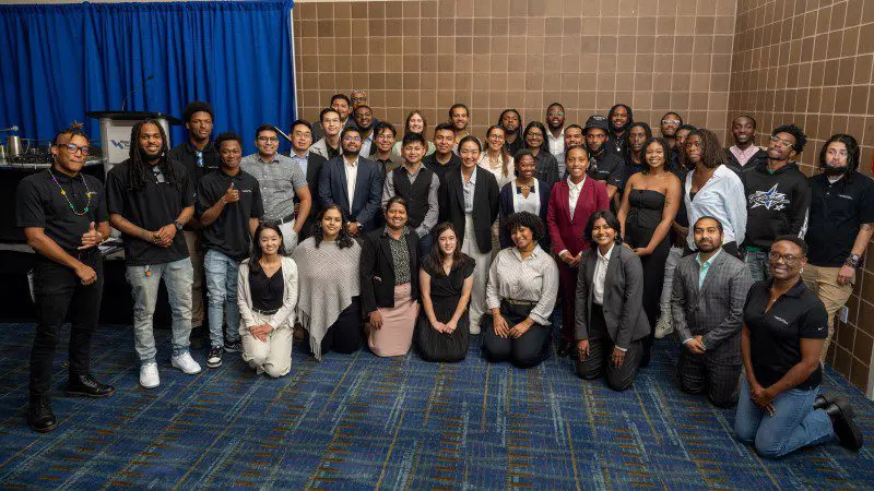 Group of students smiling for the camera at WEF InFLOW event